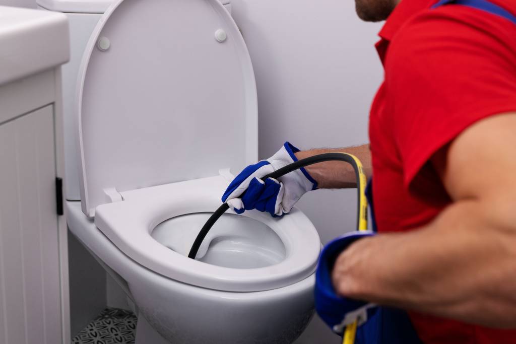 Plumber performing drain cleaning and camera inspection in Memphis