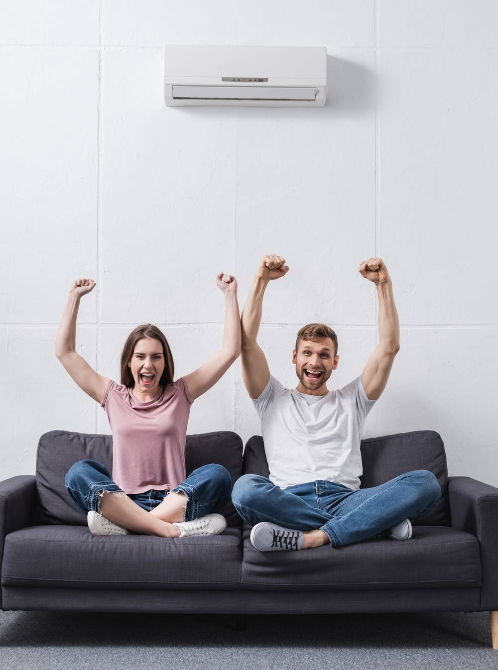 excited shouting couple at home with air conditioner excited shouting couple at home with air conditioner